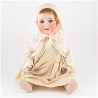 Lot 218 - Heubach Koppelsdorf Germany bisque head doll, head stamp 300.9 with open mouth and sleeping eyes, composition body, with what appears to be an original outfit, 65cm tall.