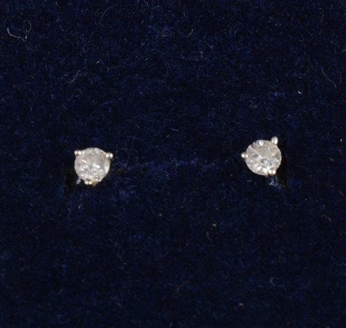 Lot 260 - A pair of small diamond earstuds, the brilliant cut diamonds three claw set in 9 carat white gold mounts with post and butterfly fittings
