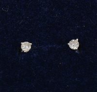 Lot 260 - A pair of small diamond earstuds, the brilliant cut diamonds three claw set in 9 carat white gold mounts with post and butterfly fittings