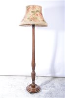 Lot 366 - A walnut standard lamp, early 20th century.