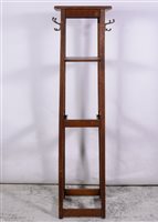 Lot 346 - An oak snooker cue stand, squire tapering frame, with four brass hooks, width 40cm, depth 38cm, height 175cm.