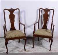 Lot 406 - Pair of walnut elbow chairs in the Queen Anne style, drop in seats, 57cm.