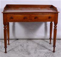 Lot 374 - Victorian mahogany side table, rectangular to with three-quarter gallery, moulded edge, two frieze drawers with turned handles, turned legs, width 91cm, depth 48cm, height 77cm.
