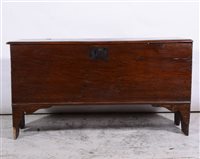 Lot 381 - Joined oak coffer, basically 18th Century, rectangular hinged lid with a moulded edge, plain front panel with chipped carved outlines, width 119cm, depth 40cm, height 65cm.