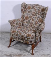 Lot 355 - Victorian mahogany framed armchair, floral tapestry styled upholstery, shaped arms, carved and turned legs on castors, width 69cm.