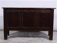 Lot 380 - Joined oak coffer, 19th Century, rectangular hinged top with a moulded edge, lunette carved frieze above three panels, width 123cm, depth 48cm, height 76cm.