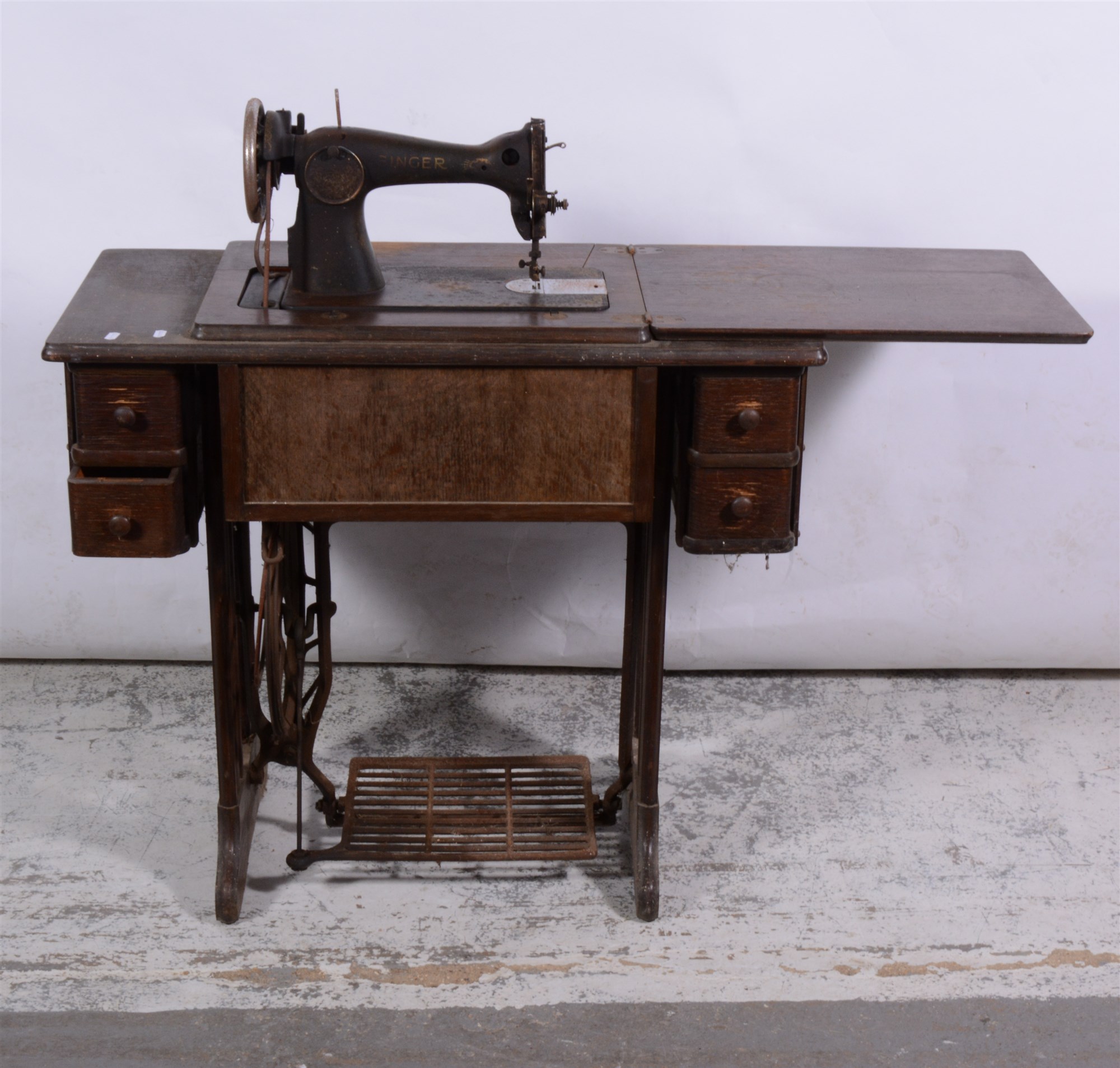 Lot 403 - Oak treadle sewing machine.