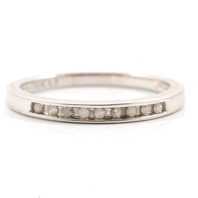 Lot 314 - A diamond half eternity ring.