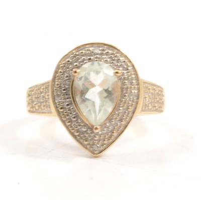 Lot 312 - A very pale blue quartz and diamond pear shaped cluster ring.