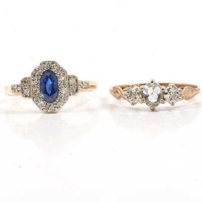 Lot 311 - A sapphire and diamond oval cluster ring, and an aqua-coloured gemstone and diamond ring.