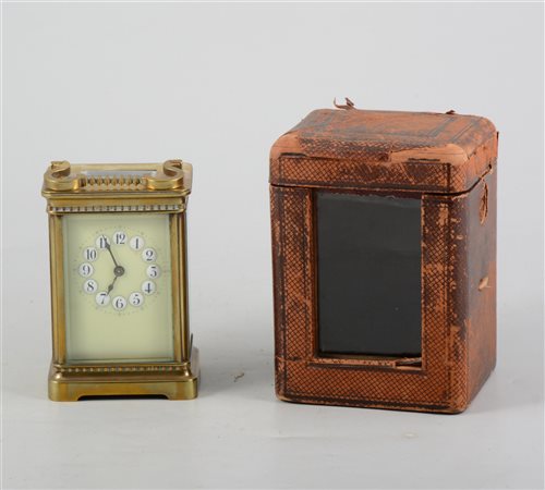 Lot 149 - Brass cased carriage clock, enamelled dial, non striking movement, 12cm, with leather covered travelling case.