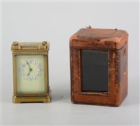Lot 149 - Brass cased carriage clock, enamelled dial, non striking movement, 12cm, with leather covered travelling case.