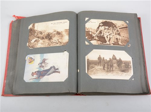Lot 102 - Postcard album containing approximately 90 First World War cards and later.