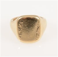 Lot 233 - A 9 carat yellow gold signet ring, the rectangular head 17mm x 13mm having a scroll engraved pattern to each side, ring size Q, approximate weight 14.7gms.