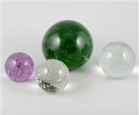 Lot 37 - Five glass bubble paperweights, with controlled bubble design, various sizes. (5)