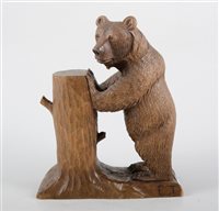 Lot 195 - A hand-carved figure of a Black Forest bear, signed E.T., 20cm high, 17cm wide.