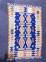 Lot 429 - A small Kilim rug together with two Kilim cushions (3)