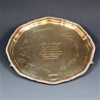 Lot 174 - Silver salver by Cooper Brothers & Sons Ltd, gadroon edge on four ball and claw feet, presentation inscription to centre surrounded by facsimile signatures, Sheffield 1977, 25.5cm diameter, 17.3 oz.