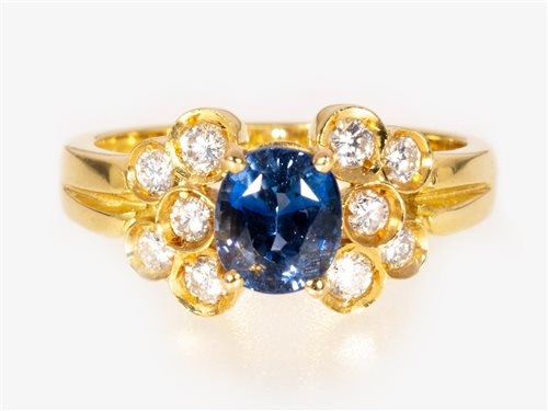 Lot 168 - A sapphire and diamond "butterfly" design cluster ring