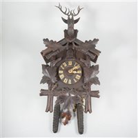 Lot 148 - Black Forest cuckoo clock, the case surmounted with a carved stag head.