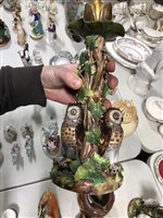Lot 16 - Pair of 19th Century German porcelain candlesticks, with owl design bases.