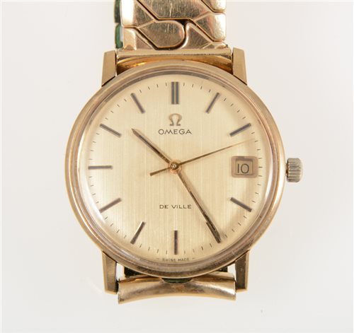 Lot 319 - Omega - a gentleman's gold Geneve wrist watch, 29mm circular champagne baton dial with centre seconds hand and date aperture