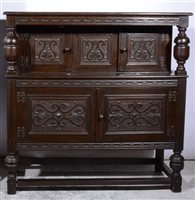 Lot 347 - Reproduction oak court cupboard, carved panelled doors, width 123cm depth 43cm, height 123cm.