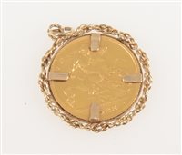 Lot 299 - A Half Sovereign George V 1925 in a 9 carat yellow gold rope edge pendant mount on an oval link chain 48cm long, total weight approximately 11gms.