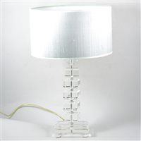 Lot 496 - A modern table lamp, clear perspex column on a glass base, with metallic silver shade