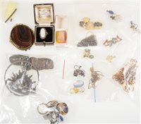 Lot 286 - A quantity of earrings, dress rings, broken pieces of jewellery including an amount of silver, gold and a tooth.