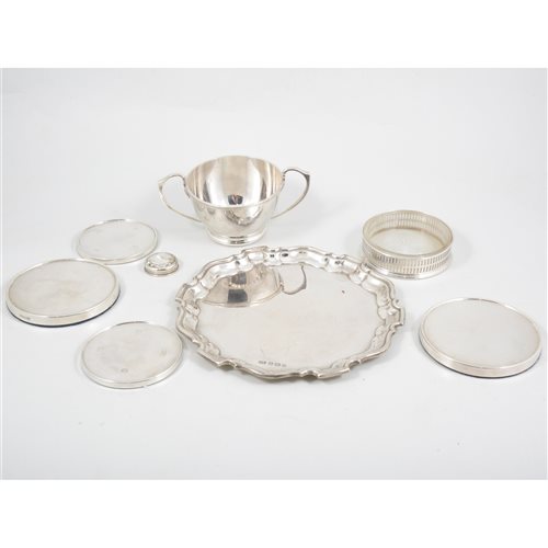 Lot 197 - A silver Chippendale-style waiter by Viner's Ltd Sheffield 1953; a small twin-handled porringer, Deakin & Francis Ltd, Birmingham 1931; a pair of Carr's coasters Sheffield 1996. (8)