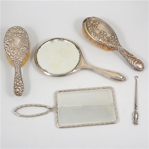 Lot 187 - A collection of silver and silver backed dressing table items, hand mirror, brushes, an ebony brush etc
