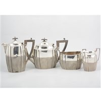 Lot 200 - A silver four piece teaset by James Dixon & Sons Ltd, oval body, the lower half having narrow vertical fluting, ebony handles to pots, hallmarked Sheffield 1907, total weight approximately 37oz.