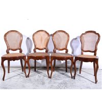 Lot 492 - Set of four French stained beechwood dining chairs, cane panelled backs and seats, moulded cartouche backs, on slender cabriole legs, height 96cm.