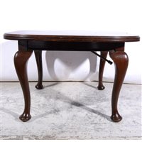 Lot 499 - Edwardian walnut extending dining table, with a single leaf, rounded ends and a moulded edge, on four cabriole legs, 148cm x 103cm.