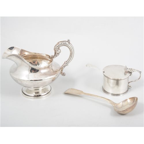 Lot 201 - A silver jug, London 1837, 12cm high; a silver sauce ladle, William Eaton, London 1828; a drum mustard pot with blue glass insert, William Chawner II, London 1839. (4)