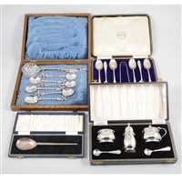 Lot 199 - A cased set of silver bright cut teaspoons with sugar tongs by John Sanderson, Sheffield 1912; a cased set of six white metal Dutch teaspoons, with crested bowls and windmill finials (4)