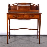 Lot 484 - An Edwardian mahogany ladies' writing desk with inset black leather top, two drawers, raised stationery alcoves and correspondence box, on square tapering legs, 96cm high, 84cm wide, 53.2cm deep.