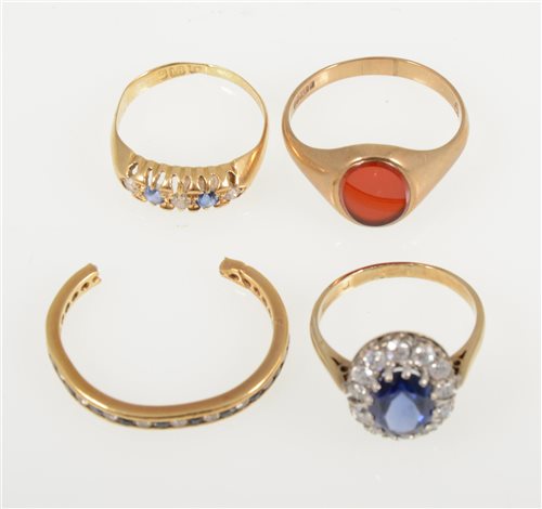 Lot 244 - Four various rings, a 9 carat yellow gold signet ring set with cornelion, ring size S, an 18 carat yellow gold ring set with two sapphires and three old cut diamonds size M