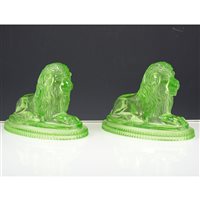 Lot 31 - Pair of John Derbyshire green moulded glass lions, signed to base and dated 3rd July 1874.