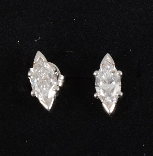 Lot 261 - A pair of diamond stud earrings, the marquise cut stones V claw set to top and bottom with claws to side