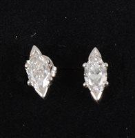 Lot 261 - A pair of diamond stud earrings, the marquise cut stones V claw set to top and bottom with claws to side