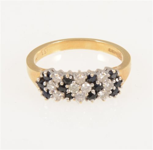 Lot 218 - A sapphire and diamond half hoop cluster ring, twelve sapphires and ten brilliant cut diamonds