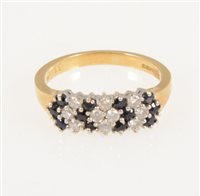 Lot 218 - A sapphire and diamond half hoop cluster ring, twelve sapphires and ten brilliant cut diamonds