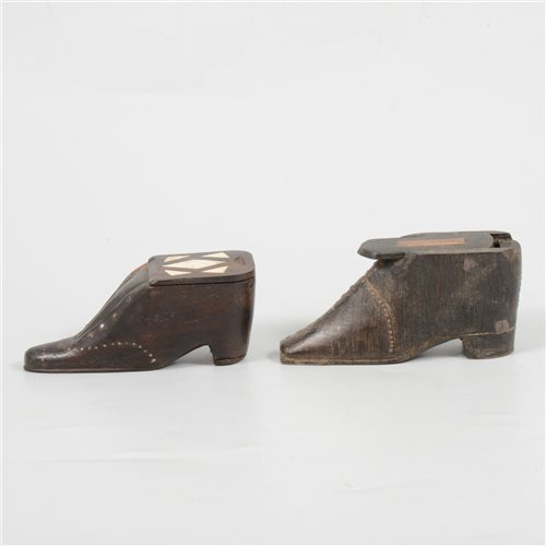 Lot 154 - Pair of treen carved wooden shoe snuff boxes both with metal stud detail and sliding tops, 9cm. (2)