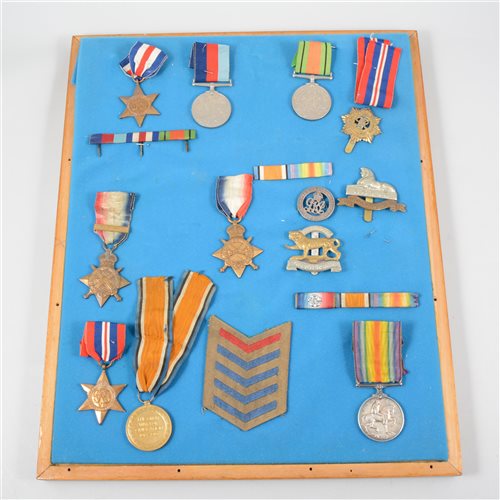 Lot 147 - A board of WW1 and WW2 medals, including 1914 Star, British War Medal and Victory Medal awarded to 9238 Pte then L. Cpl J W Gibbs, 1/Linc R; 1914-15 Star awarded to SE-7723 Pte R B Waters, AVC