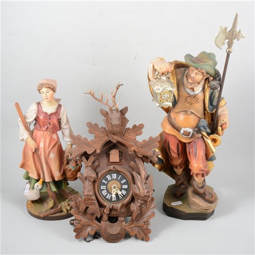 Lot 110 - Cuckoo clock and two wooden figures.
