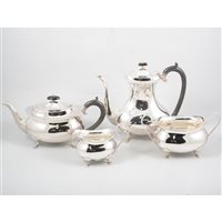 Lot 171 - A silver four piece tea/coffee set by Joseph Gloster Ltd , plain polished body on four paw feet, ebony handles and finials to top, hallmarked Birmingham 1921, total weight approximately 57.2oz.
