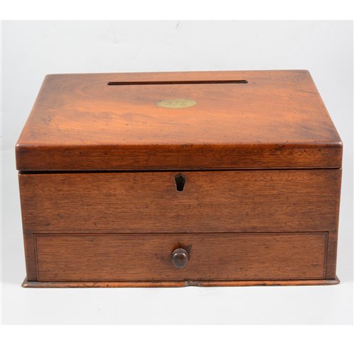 Lot 147 - A mahogany slope front stationery box with letter slot to top, the interior fitted with letter racks and recess for ink bottles, peg release for drawer below