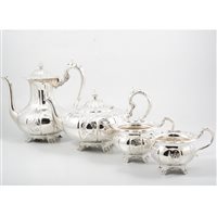 Lot 167 - A modern silver four piece tea/coffee service by Roberts & Dore, melon shaped body with alternating plain and embossed panels, hollow cast handles and finials